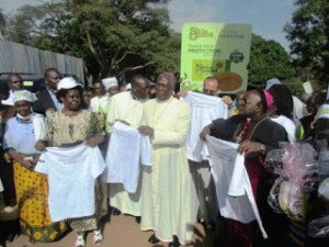 Archbishop Lwanga (right), Bishop Zziwa (center) and Hon. Mutagamba (left) flag-off the pilgrims for the Walk of Faith