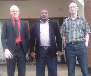 Chiphwanya (C) with Chair for the Association with people with Albinism (L) after meeting for a discussion