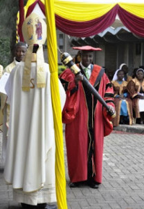 Prof. Mbae holding the Symbol of Power right after being Installed Vice Chancellor of CUEA