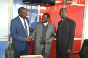 New Deputy General Secretary of KCCB Rev. Fr. Lukas Ongesa  (center)  being introduced by  KCCB General Secretary  Rev. Fr. Daniel Rono (right) to Waumini  Communications Ltd. Director Mr. David Omwoyo (left)